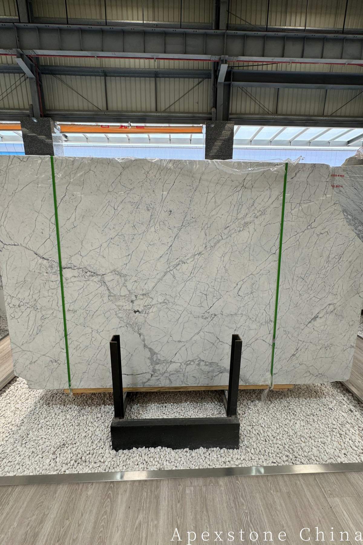 Statuario marble slab with bright white ground and bold grey veining