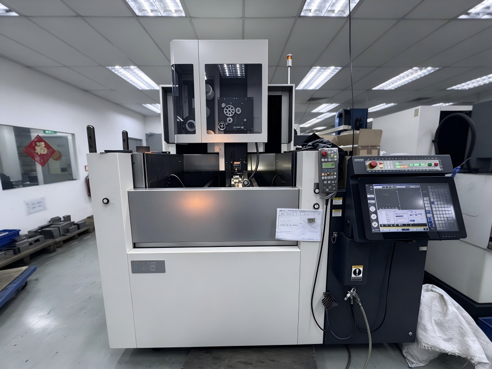 EDM machining center with control panel in the workshop