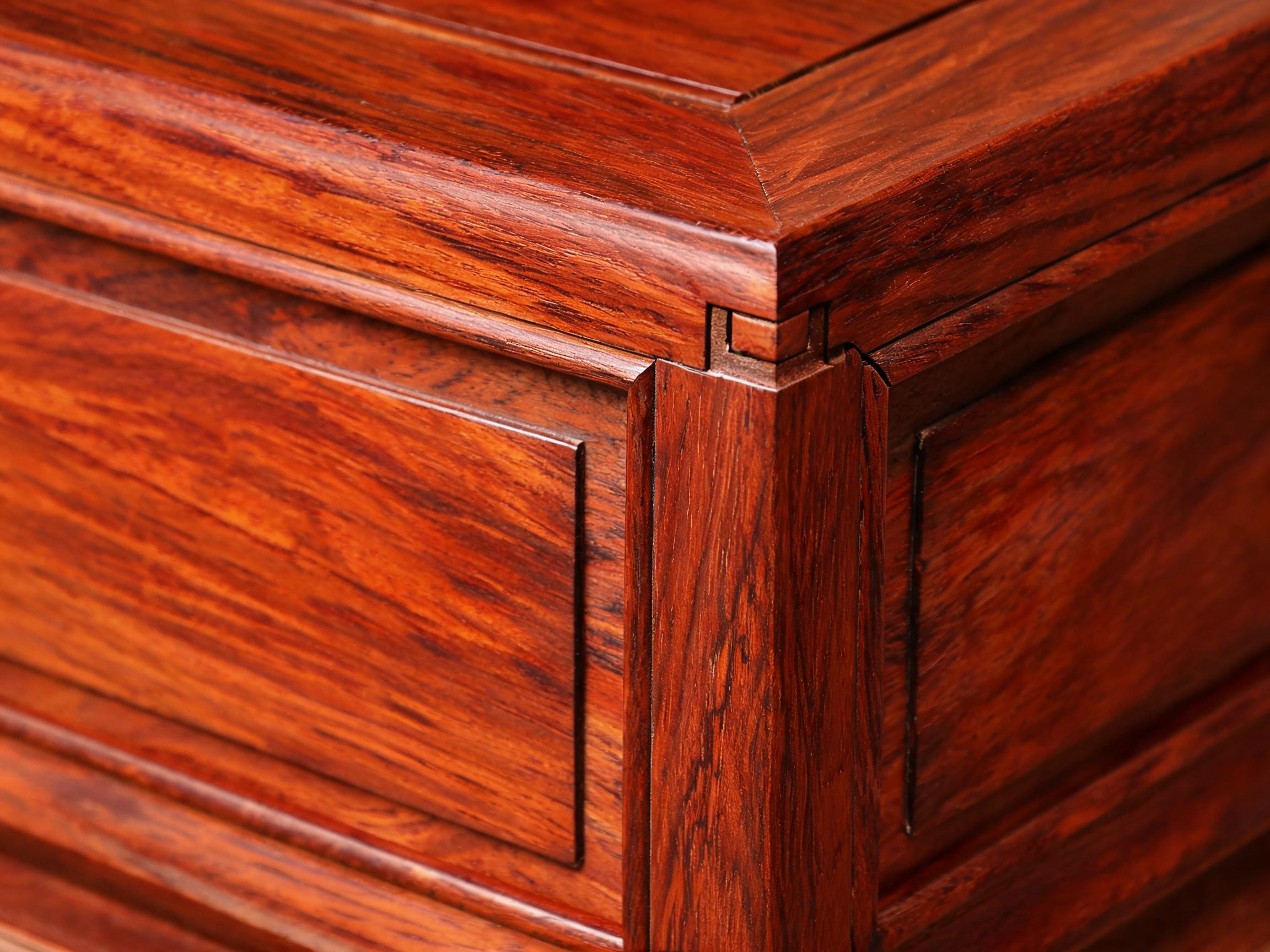 Floating-panel construction with expansion gap and mortise-and-tenon corner joint on rosewood display cabinet