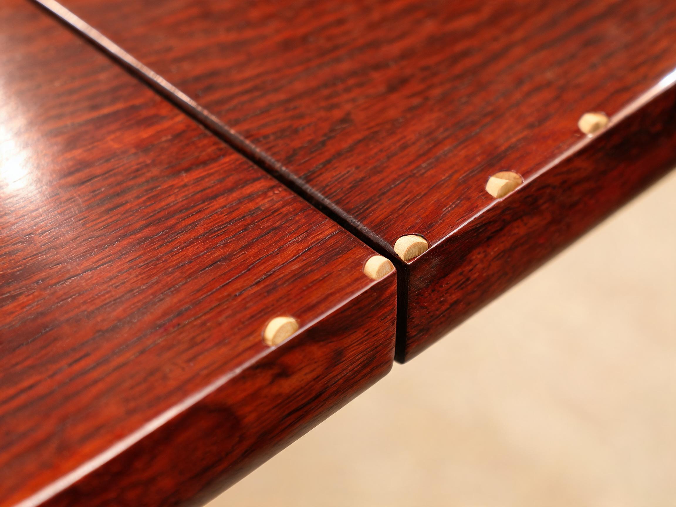 Bamboo dowel edge joint on the Siamese rosewood tabletop, boards joined without metal biscuits