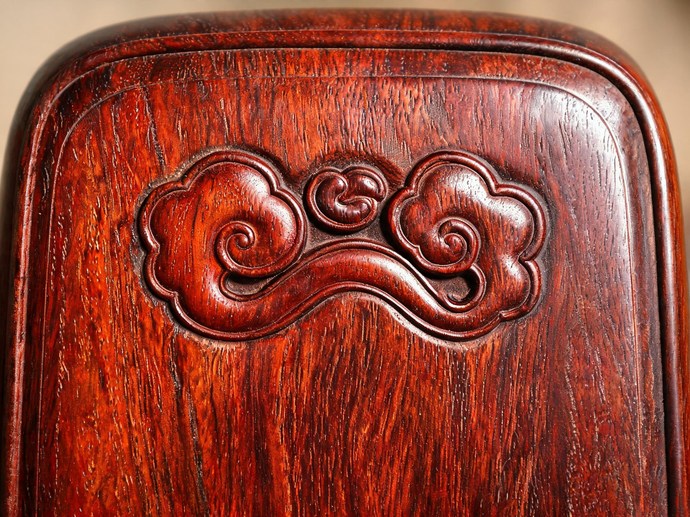 Hand-carved ruyi sceptre motif in 2-4 mm relief on the Siamese rosewood backrest panel