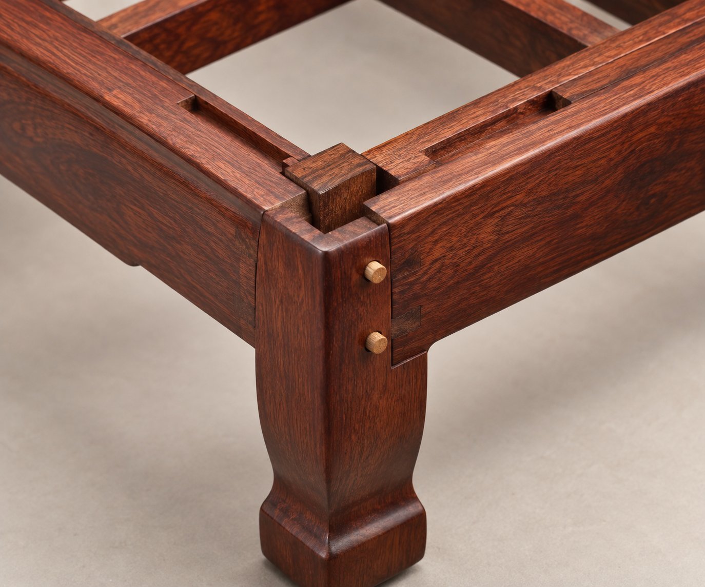 Corner mortise-and-tenon joint with solid wood corner block and bamboo dowels on a Siamese rosewood sofa frame