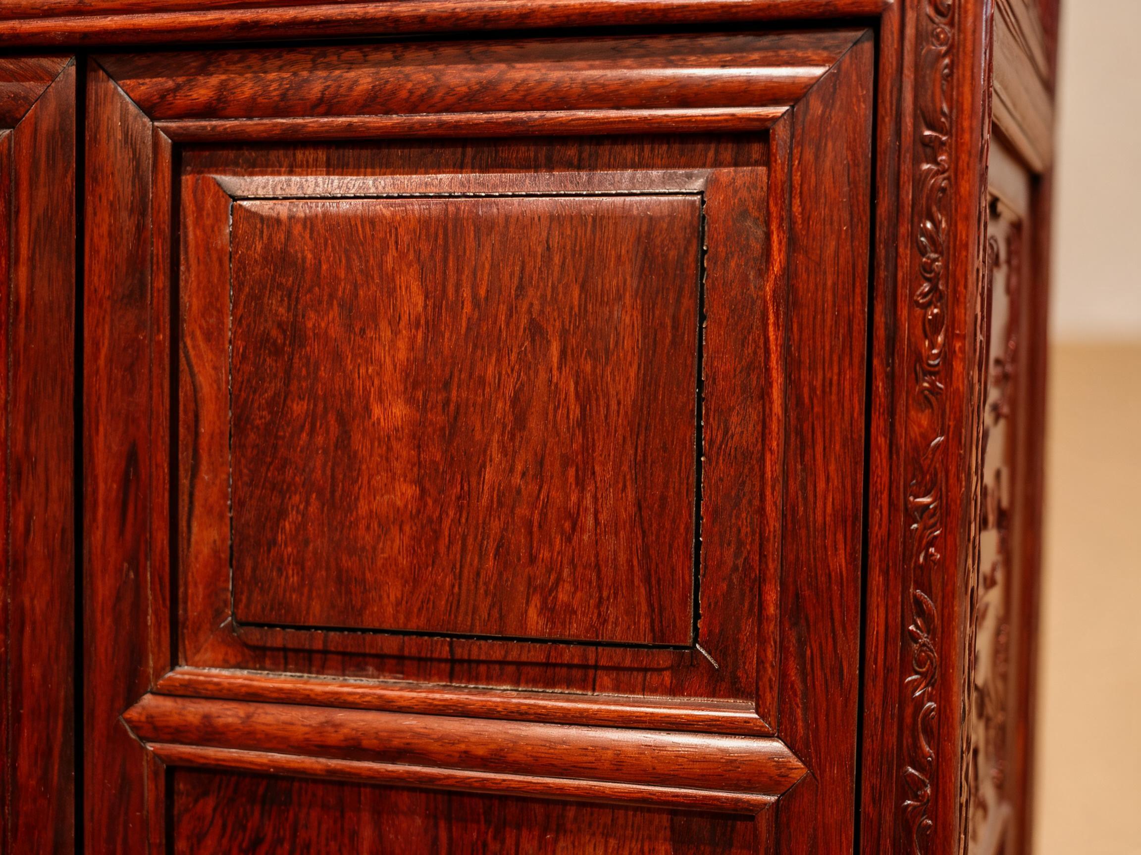Floating-panel wardrobe door detail showing the solid rosewood panel seated in a grooved frame with a visible expansion gap
