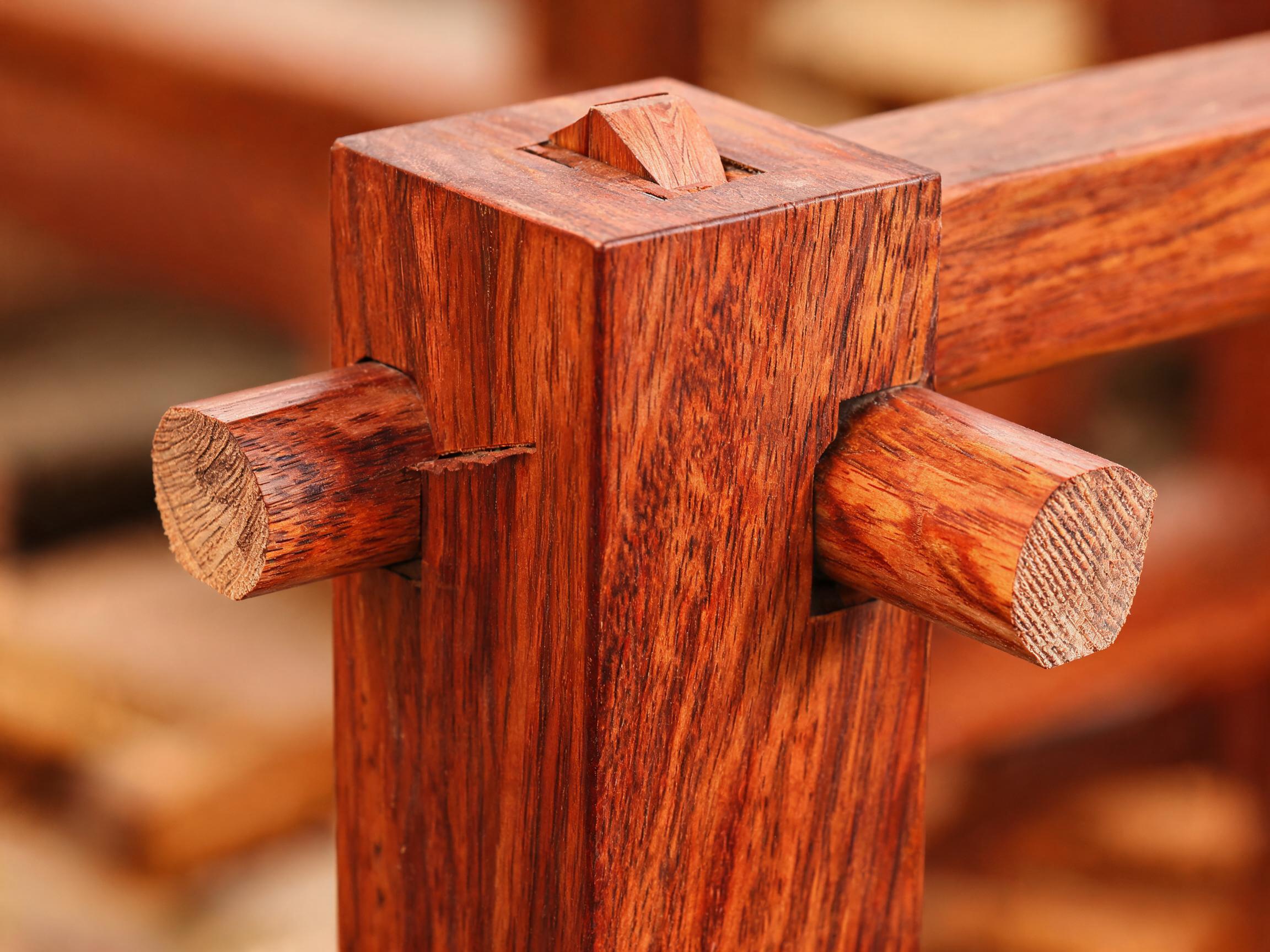 Through-tenon canopy joint wedged from above on a solid rosewood bed post