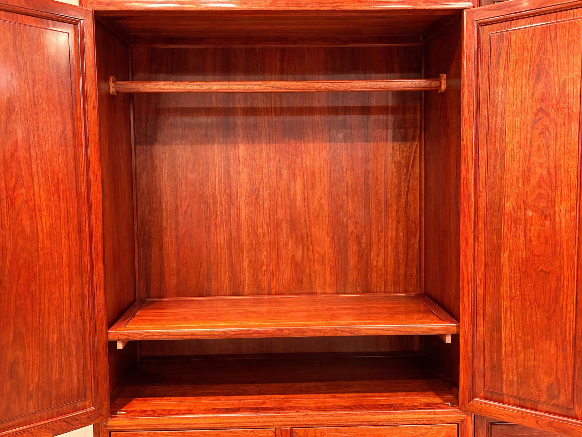 Interior hanging rod and lacquer finish detail on Siamese rosewood wardrobe