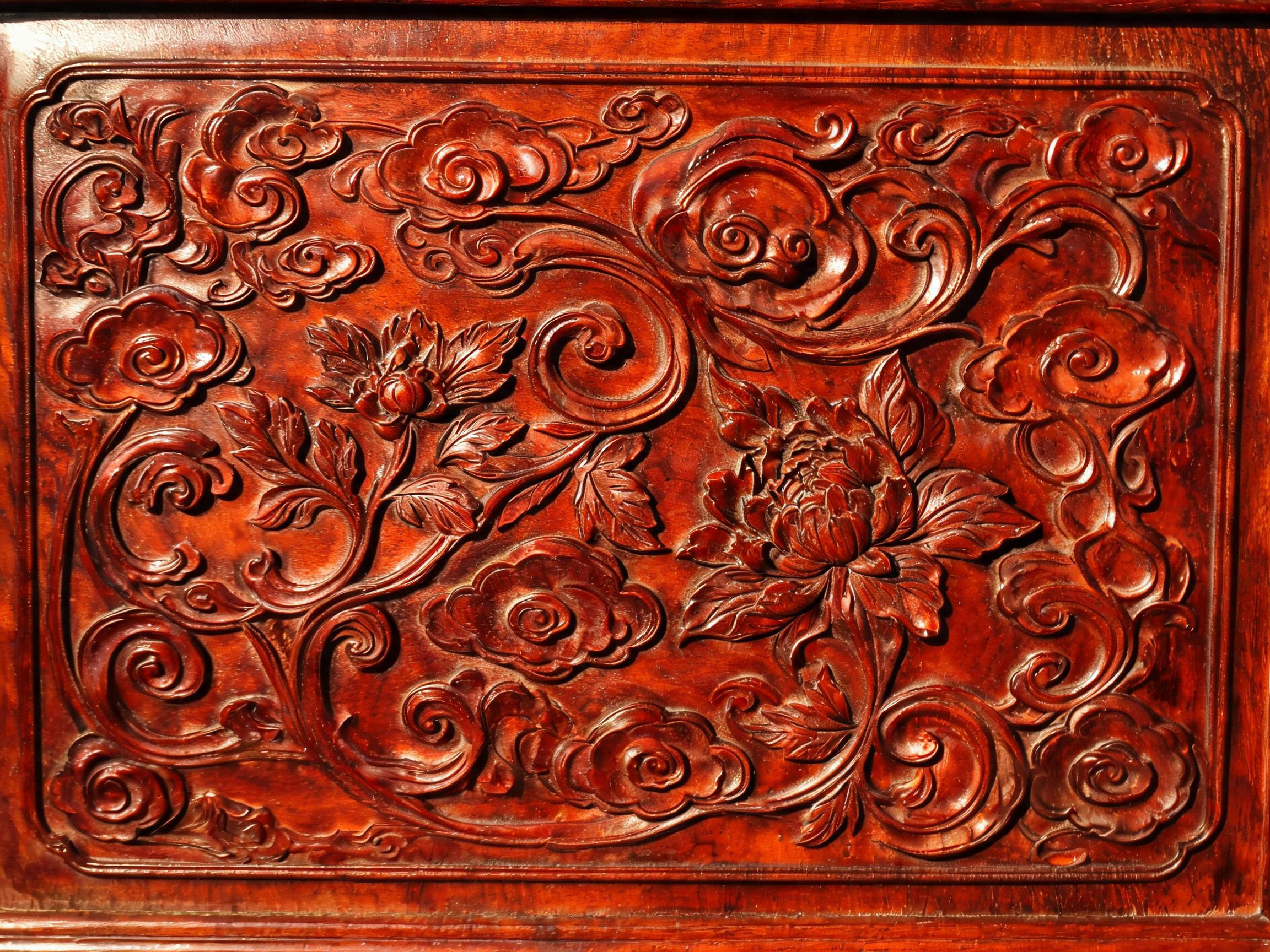 Hand-carved cloud and floral apron detail in medium relief on Siamese rosewood sideboard