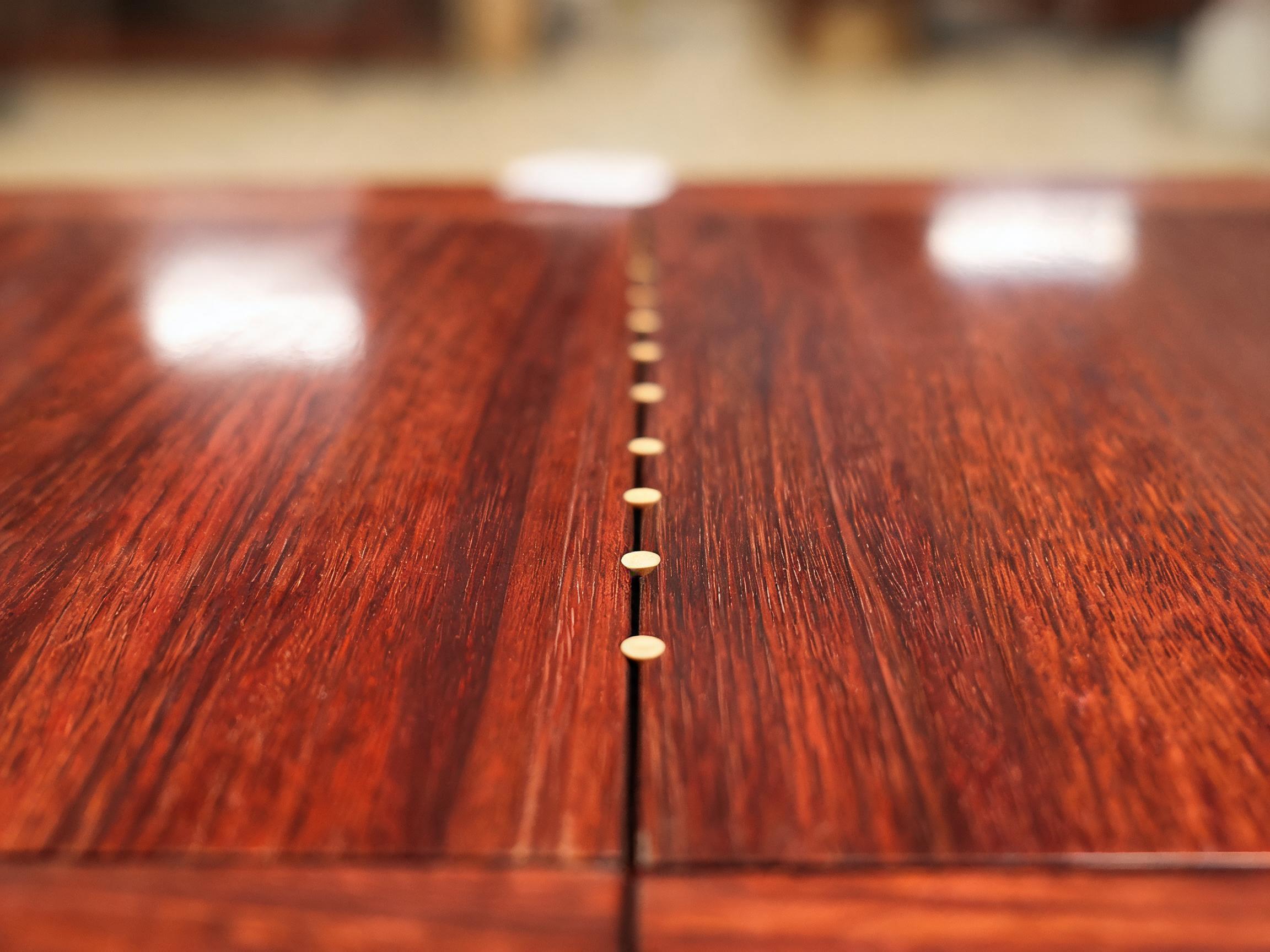 Edge-joined Siamese rosewood tabletop boards with bamboo dowel pins along the join line