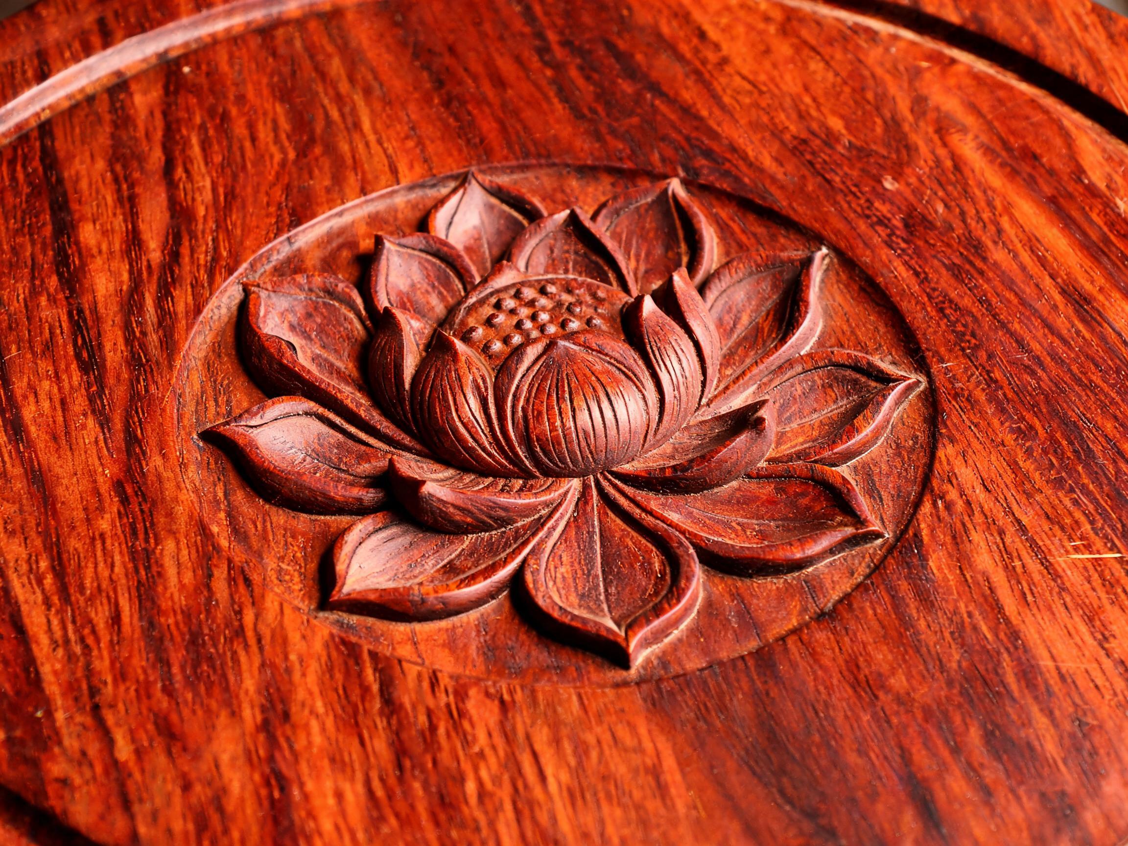 Hand-carved lotus medallion in shallow relief on a solid Siamese rosewood stool seat