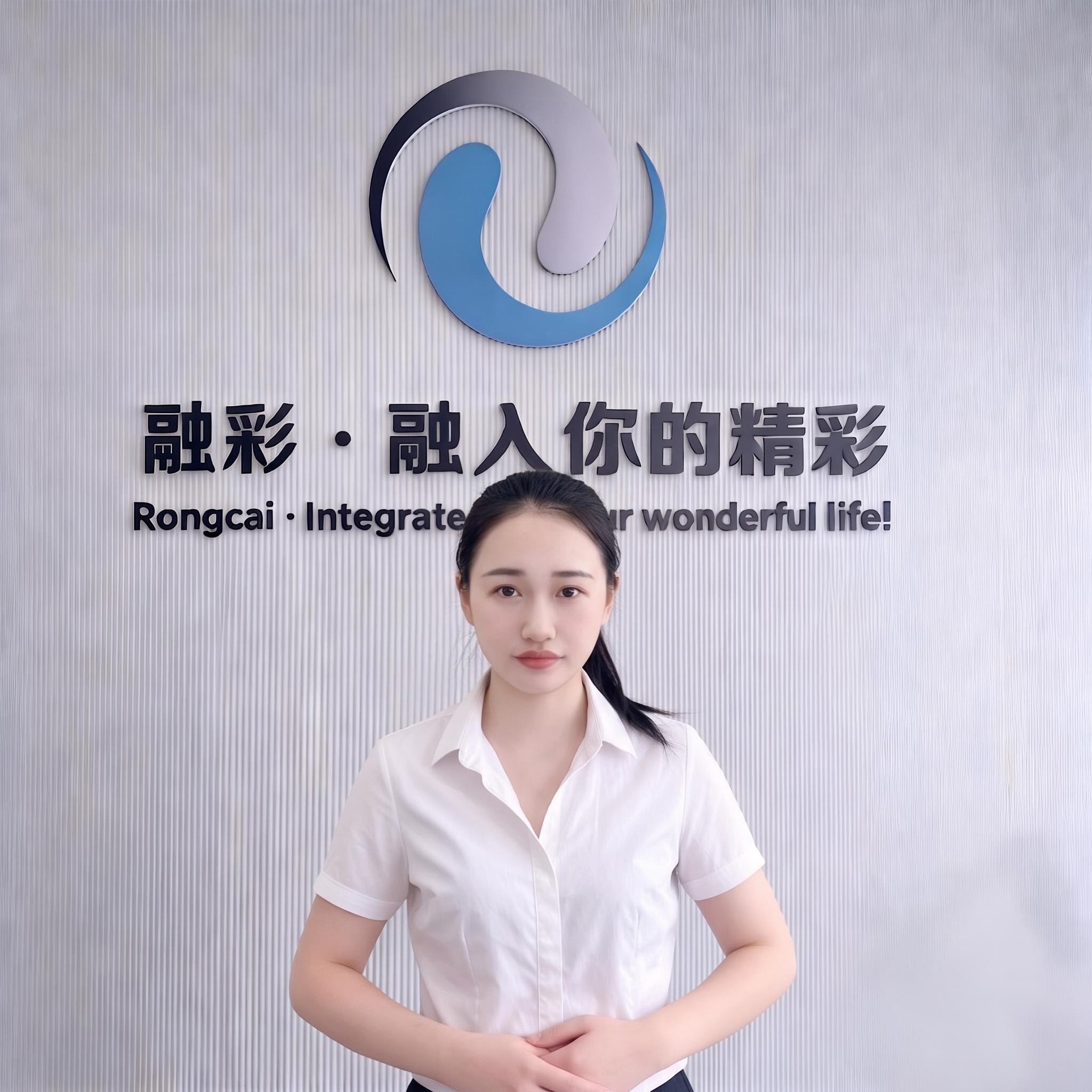 Hanna, sales contact at Zhejiang Rongcai Machinery, in front of the Rongcai brand wall