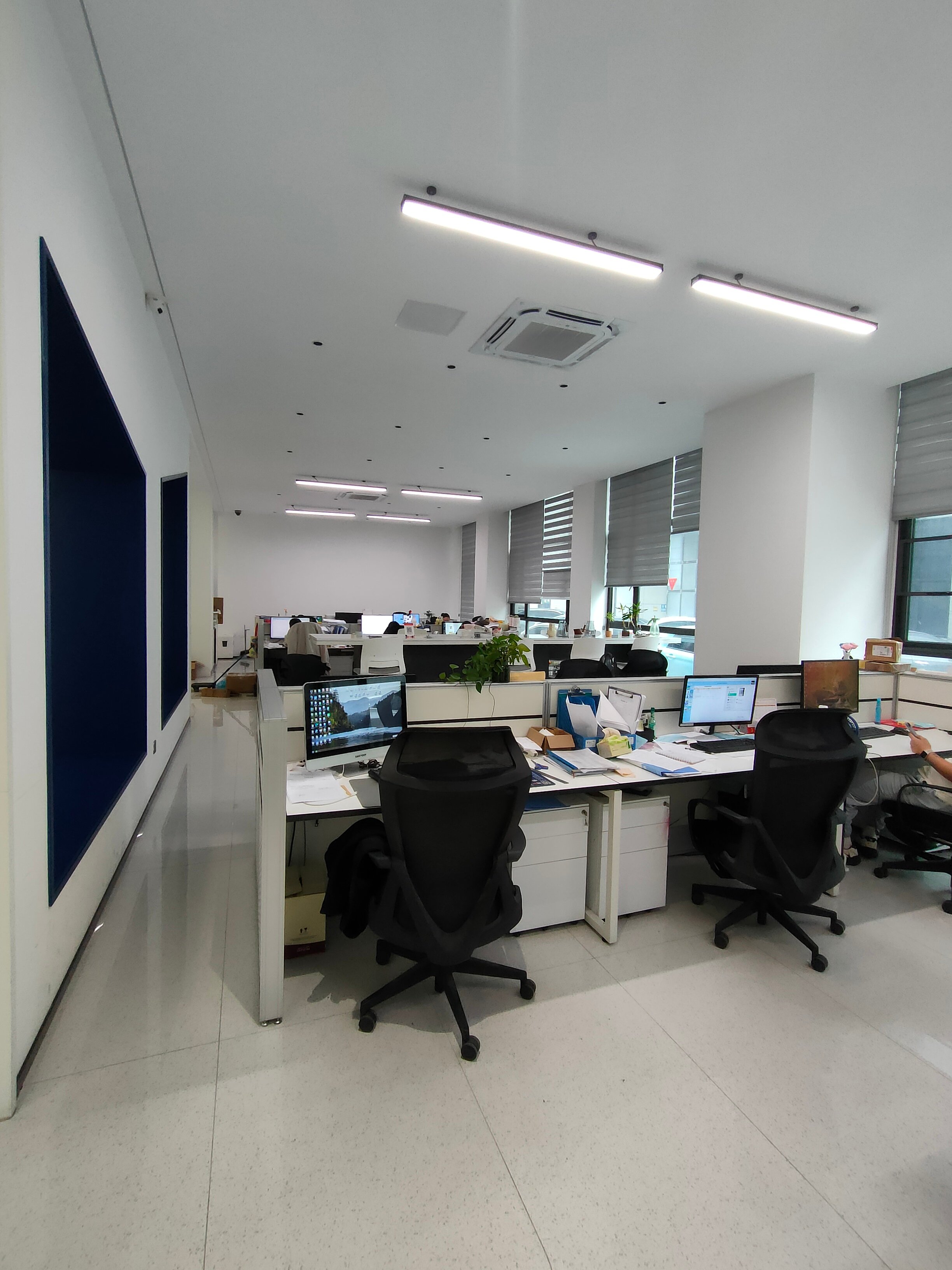 Open-plan office area with workstation clusters